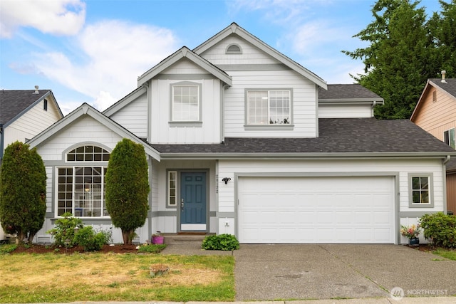 20122 102nd Ave SE, Kent, WA 98031 - traditional-style home featuring driveway, a garage, roof with shingles, and board and batten siding