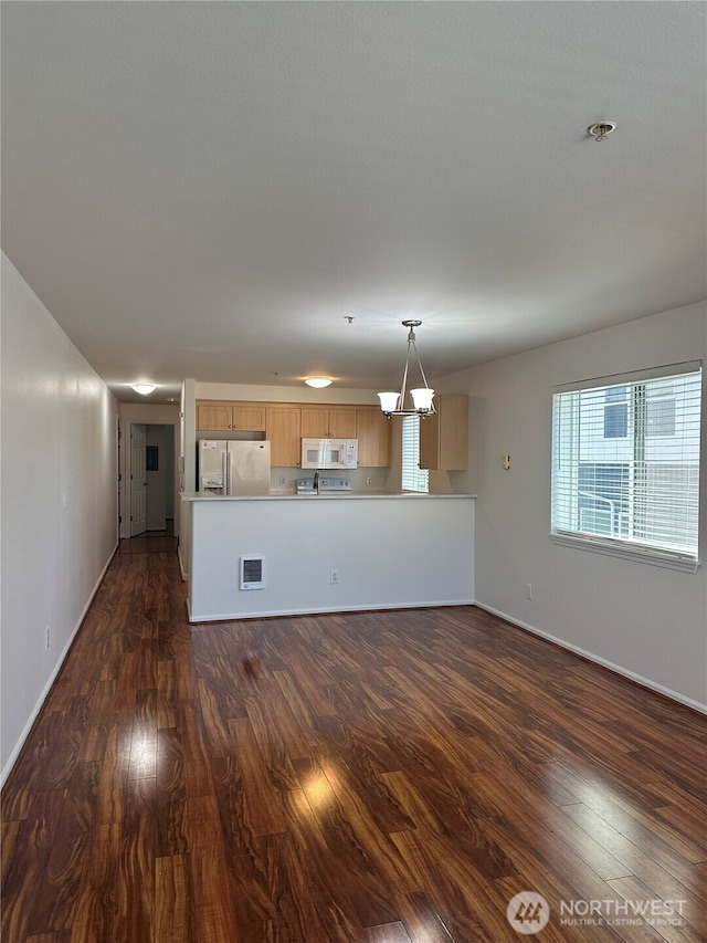 10511 Midvale Ave N Unit 202, Seattle, WA 98133 - unfurnished living room with dark wood-type flooring and a chandelier