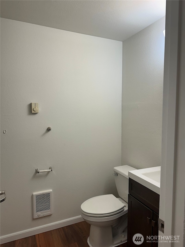 10511 Midvale Ave N Unit 202, Seattle, WA 98133 - bathroom featuring heating unit, vanity, and wood finished floors
