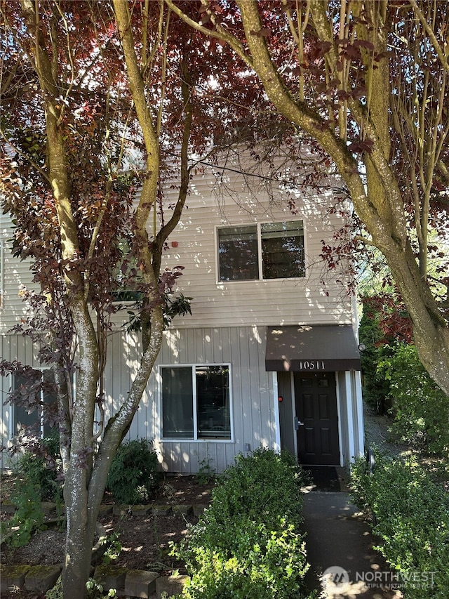 10511 Midvale Ave N Unit 202, Seattle, WA 98133 - obstructed view of property featuring board and batten siding