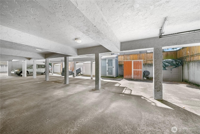 11556 Greenwood Ave N Unit 105, Seattle, WA 98133 - parking garage featuring a storage shed