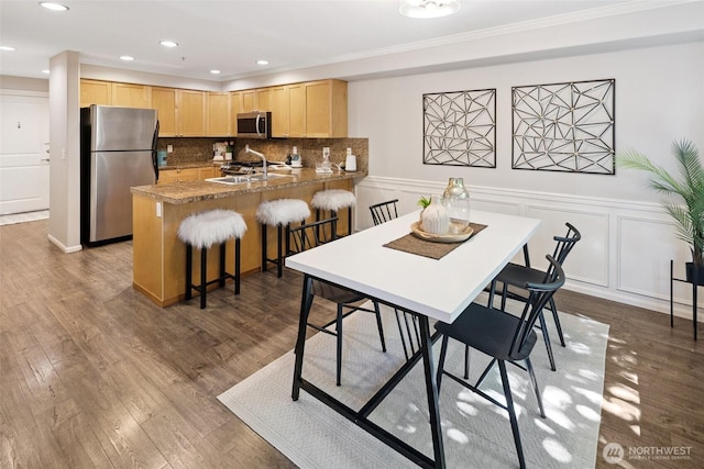 10549 Stone Ave N Unit 101, Seattle, WA 98133 - dining space with dark wood finished floors, a decorative wall, a wainscoted wall, ornamental molding, and recessed lighting