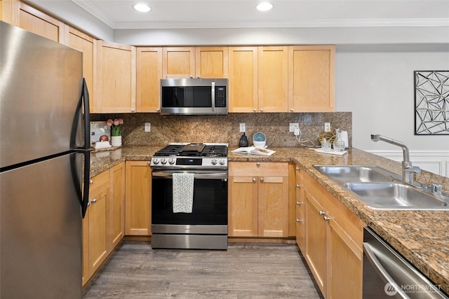 10549 Stone Ave N Unit 101, Seattle, WA 98133 - kitchen with appliances with stainless steel finishes, ornamental molding, wood finished floors, light brown cabinets, and decorative backsplash