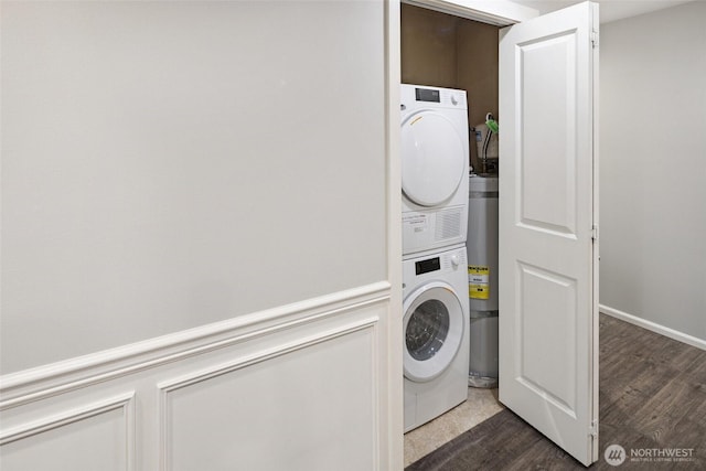 10549 Stone Ave N Unit 101, Seattle, WA 98133 - laundry area featuring stacked washer / drying machine, dark wood-style flooring, and secured water heater