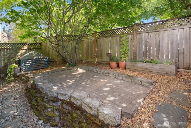 10549 Stone Ave N Unit 101, Seattle, WA 98133 - fenced backyard featuring a patio