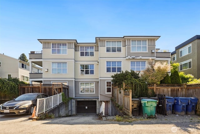 10549 Stone Ave N Unit 101, Seattle, WA 98133 - view of front facade with a garage and driveway