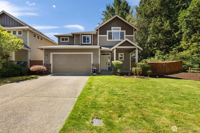 502 182nd St E, Spanaway, WA 98387 - craftsman-style home featuring driveway, stone siding, and a garage