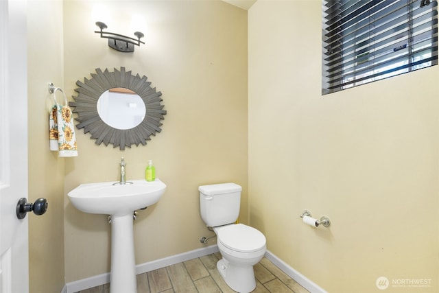 502 182nd St E, Spanaway, WA 98387 - bathroom with toilet and wood finished floors