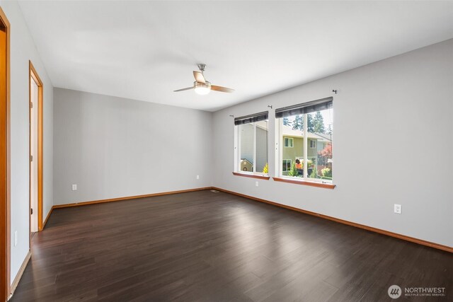 502 182nd St E, Spanaway, WA 98387 - spare room with dark wood-style floors and a ceiling fan