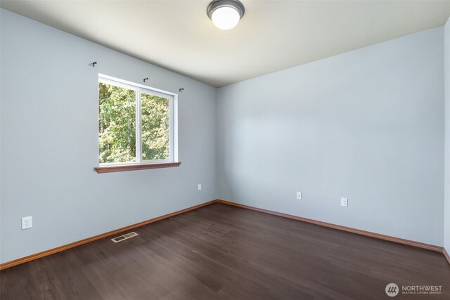 502 182nd St E, Spanaway, WA 98387 - unfurnished room with wood finished floors and baseboards