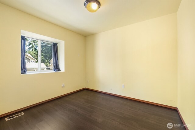 502 182nd St E, Spanaway, WA 98387 - unfurnished room featuring dark wood-type flooring and baseboards