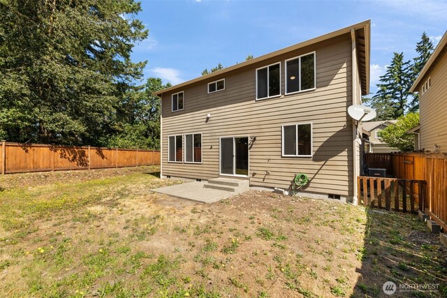 502 182nd St E, Spanaway, WA 98387 - rear view of property with a fenced backyard and entry steps