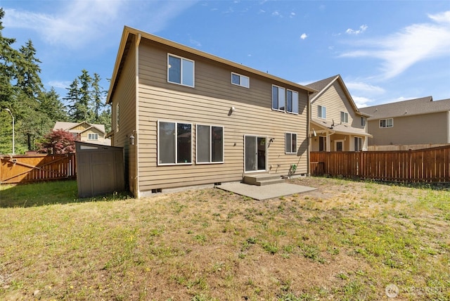 502 182nd St E, Spanaway, WA 98387 - back of property featuring a fenced backyard, crawl space, and a shed