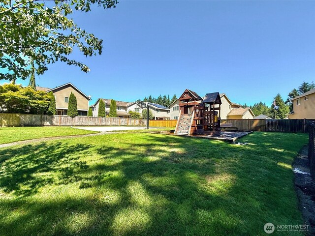 502 182nd St E, Spanaway, WA 98387 - fenced backyard with a playground