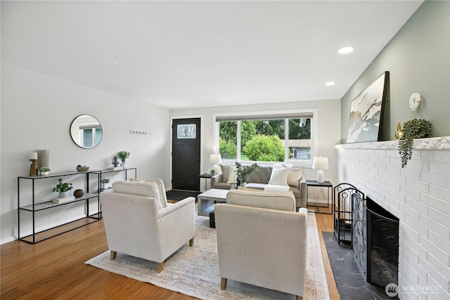 18844 SE 214th St, Renton, WA 98058 - living area with a brick fireplace, wood finished floors, and recessed lighting