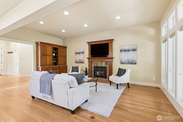 4101 Banbridge Loop SE, Olympia, WA 98501 - living room featuring light wood finished floors, a warm lit fireplace, and recessed lighting