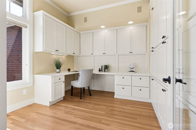 4101 Banbridge Loop SE, Olympia, WA 98501 - office featuring built in desk, crown molding, and light wood-style flooring