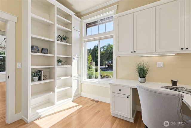 4101 Banbridge Loop SE, Olympia, WA 98501 - home office featuring light wood finished floors, built in study area, and healthy amount of natural light