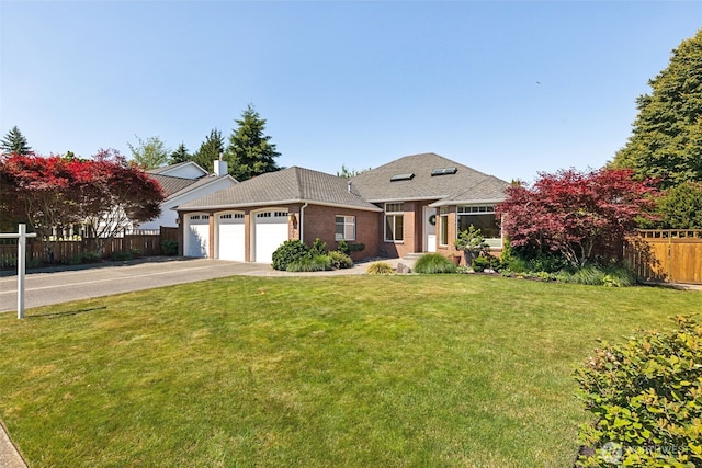 4101 Banbridge Loop SE, Olympia, WA 98501 - view of front of house with an attached garage, concrete driveway, brick siding, and a shingled roof