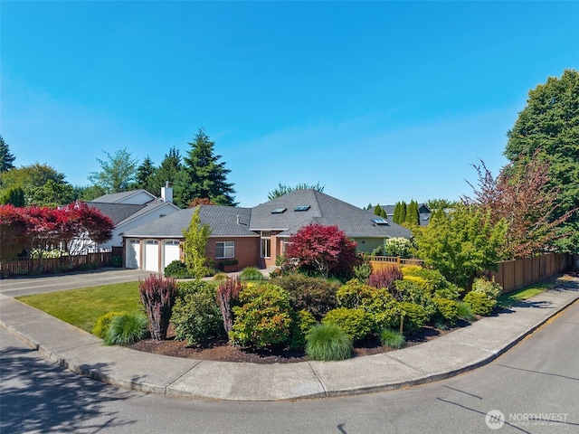 4101 Banbridge Loop SE, Olympia, WA 98501 - view of front facade featuring an attached garage, driveway, and a chimney