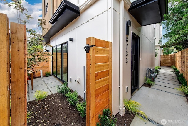 8733 13th Ave NW Unit A, Seattle, WA 98117 - view of home's exterior with french doors and stucco siding
