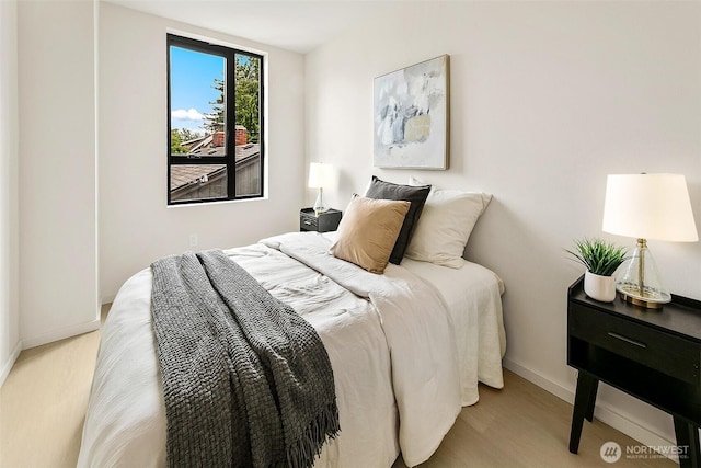 8733 13th Ave NW Unit A, Seattle, WA 98117 - bedroom featuring baseboards and light wood-style floors
