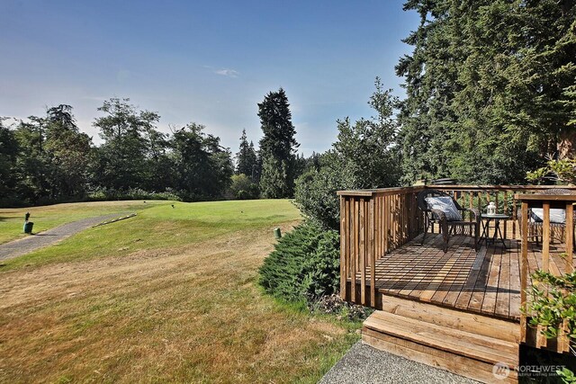 4896 Spinnaker Dr, Freeland, WA 98249 - wooden terrace with a yard and view of wooded area