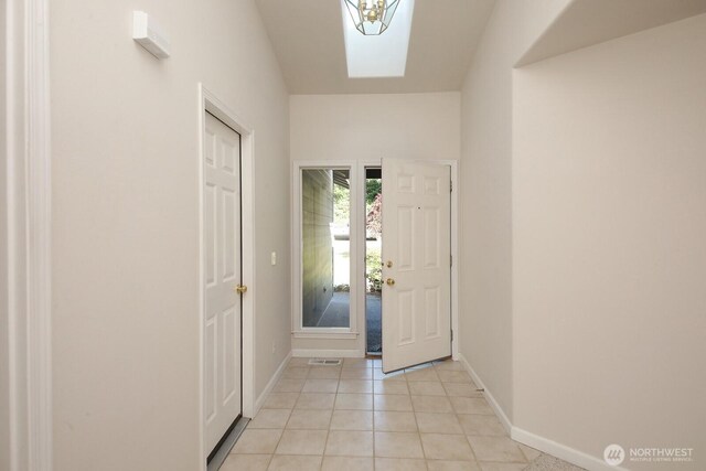 4896 Spinnaker Dr, Freeland, WA 98249 - foyer entrance with baseboards and light tile patterned floors