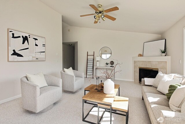 4896 Spinnaker Dr, Freeland, WA 98249 - living area featuring lofted ceiling, a tile fireplace, carpet flooring, and a ceiling fan