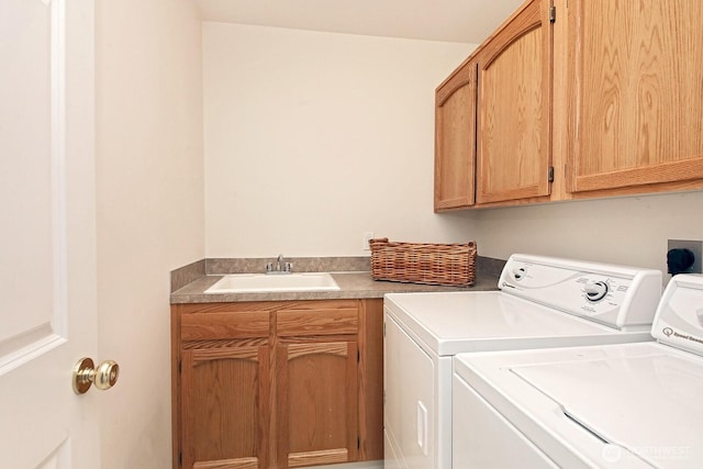 4896 Spinnaker Dr, Freeland, WA 98249 - laundry room with cabinet space and washer and clothes dryer