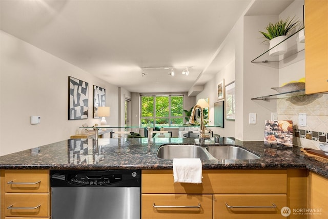 1420 E Pine St Unit E203, Seattle, WA 98122 - kitchen with dishwasher, tasteful backsplash, dark stone countertops, a peninsula, and open floor plan