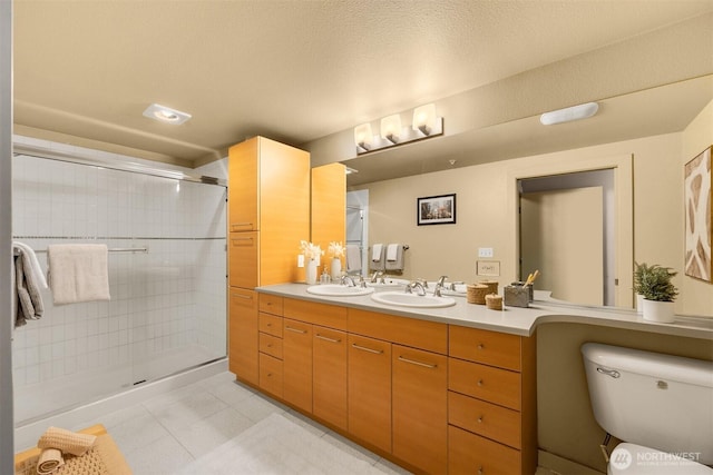 1420 E Pine St Unit E203, Seattle, WA 98122 - bathroom featuring double vanity, tiled shower, and tile patterned flooring
