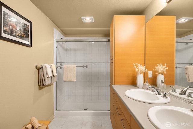 1420 E Pine St Unit E203, Seattle, WA 98122 - full bathroom featuring tile patterned floors, a shower stall, and double vanity