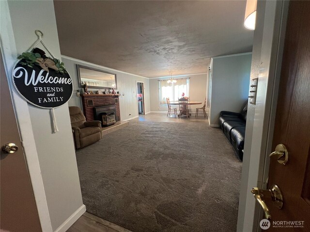 1717 Cherry St, Aberdeen, WA 98520 - living area featuring a fireplace, a chandelier, carpet flooring, and crown molding