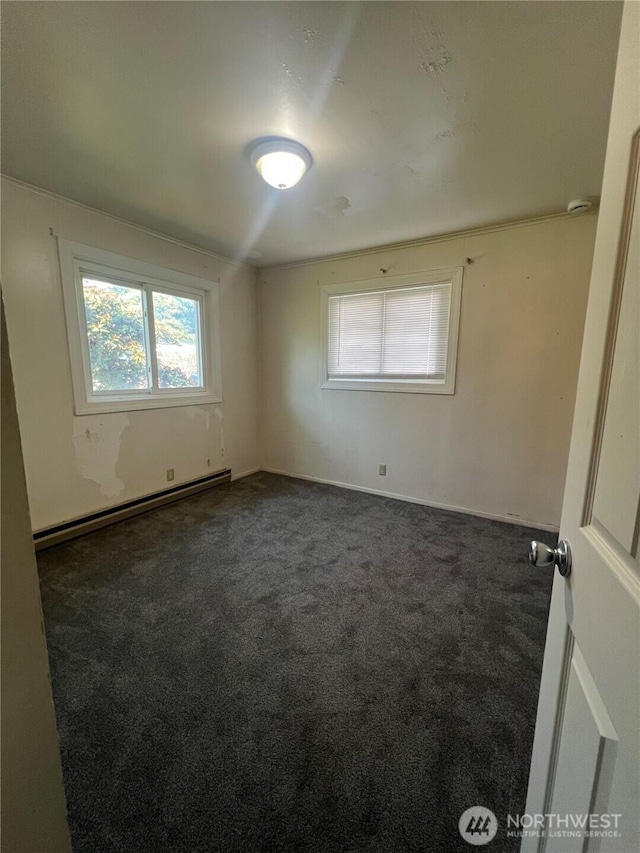 1717 Cherry St, Aberdeen, WA 98520 - carpeted empty room with a baseboard radiator