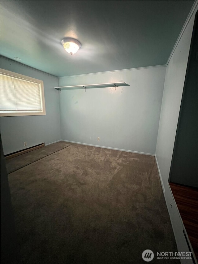 1717 Cherry St, Aberdeen, WA 98520 - spare room featuring a baseboard radiator and carpet floors
