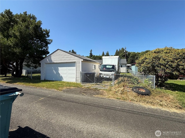 1717 Cherry St, Aberdeen, WA 98520 - view of front facade with a garage and an outdoor structure