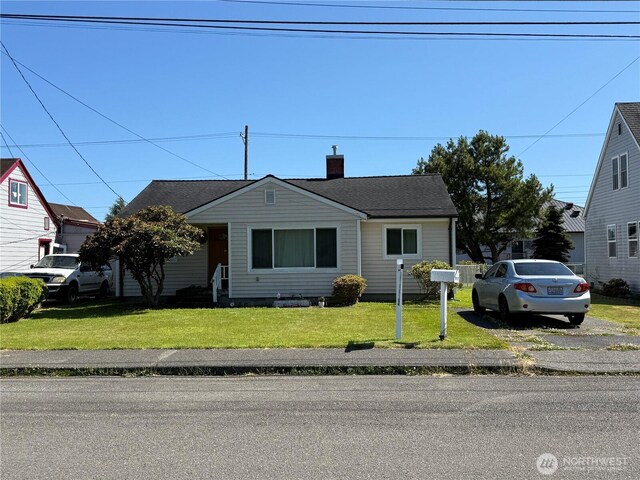 1717 Cherry St, Aberdeen, WA 98520 - bungalow-style house featuring a front yard and a chimney