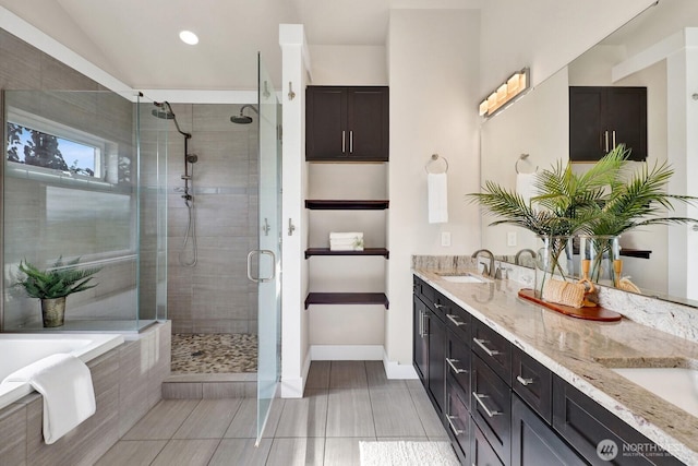 5754 W 26th Crst, Ferndale, WA 98248 - full bathroom with a stall shower, double vanity, a garden tub, tile patterned flooring, and recessed lighting