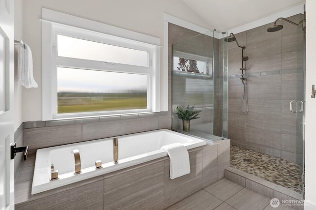 5754 W 26th Crst, Ferndale, WA 98248 - full bathroom featuring a shower stall, a bath, vaulted ceiling, and tile patterned flooring