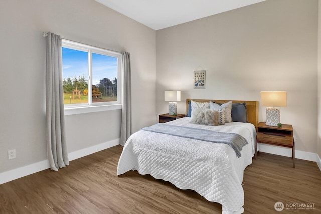 5754 W 26th Crst, Ferndale, WA 98248 - bedroom featuring baseboards and wood finished floors