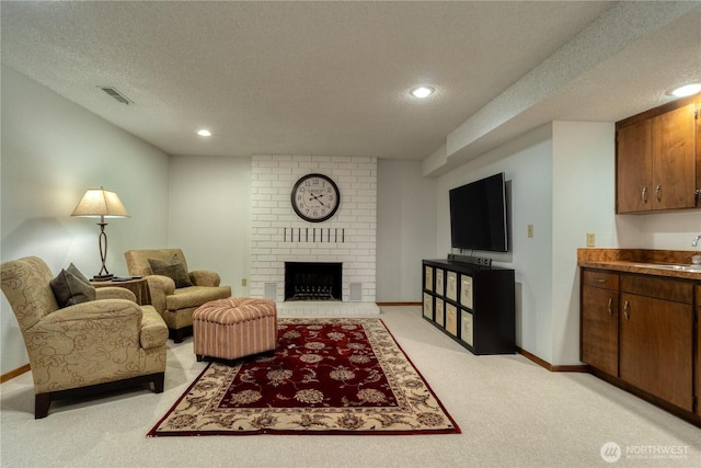 1382 Highland Rd, Walla Walla, WA 99362 - living area with a textured ceiling, light carpet, recessed lighting, and a brick fireplace