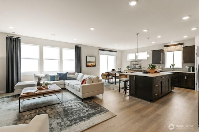 821 SE 12th Pl Unit 31, North Bend, WA 98045 - living area featuring plenty of natural light, wood finished floors, and recessed lighting