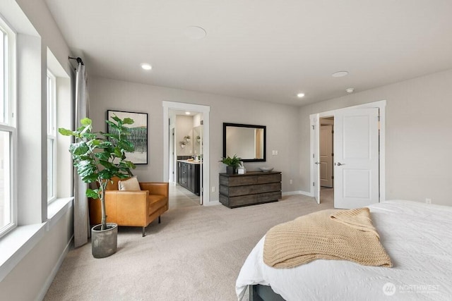 821 SE 12th Pl Unit 31, North Bend, WA 98045 - bedroom with light colored carpet, recessed lighting, and connected bathroom