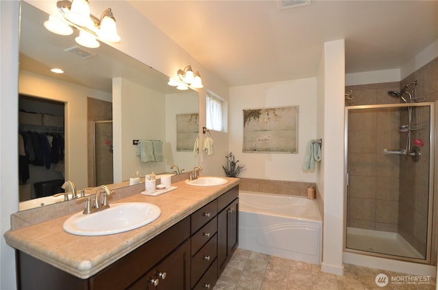 27719 NE 146th Way, Duvall, WA 98019 - bathroom featuring a stall shower, a garden tub, double vanity, and a spacious closet
