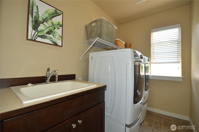 27719 NE 146th Way, Duvall, WA 98019 - washroom featuring separate washer and dryer, dark stone finish floors, and cabinet space