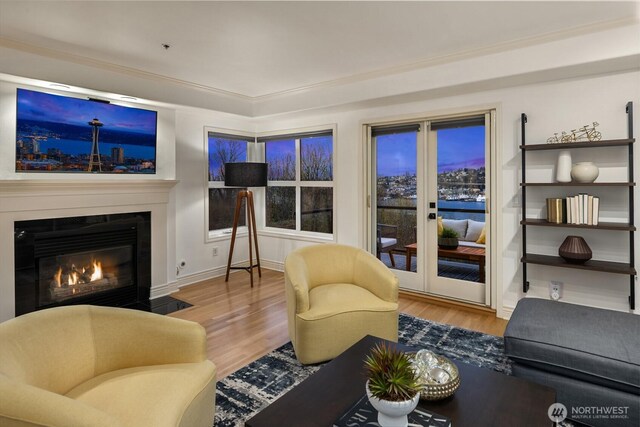 1416 6th Ave N, Seattle, WA 98109 - living area with a fireplace with flush hearth, wood finished floors, and crown molding