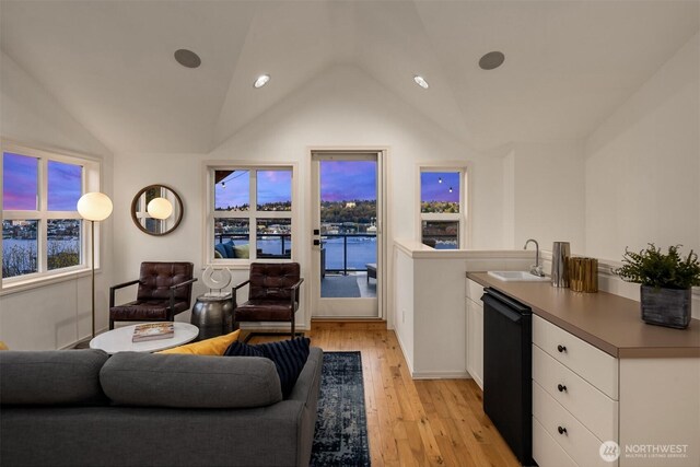 1416 6th Ave N, Seattle, WA 98109 - living area with vaulted ceiling and light wood finished floors