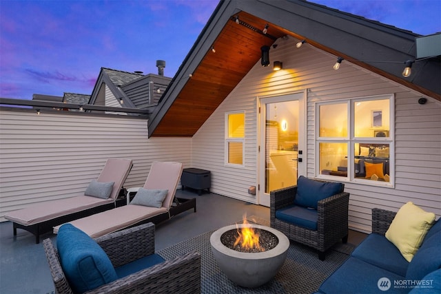 1416 6th Ave N, Seattle, WA 98109 - patio terrace at dusk featuring a patio area and an outdoor living space with a fire pit