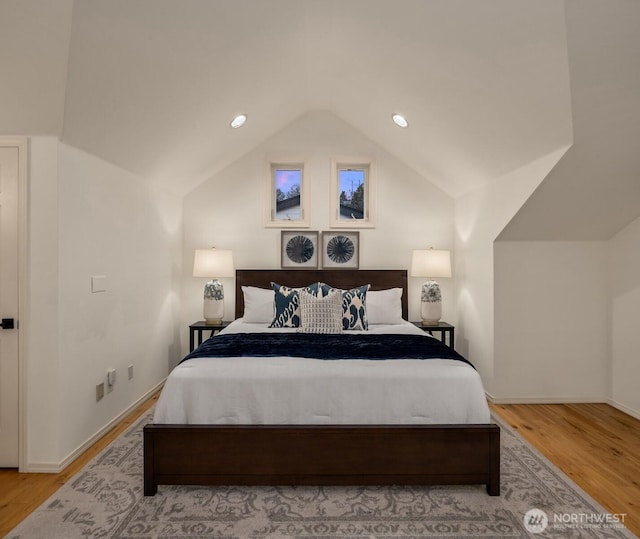 1416 6th Ave N, Seattle, WA 98109 - bedroom with lofted ceiling, wood finished floors, and recessed lighting